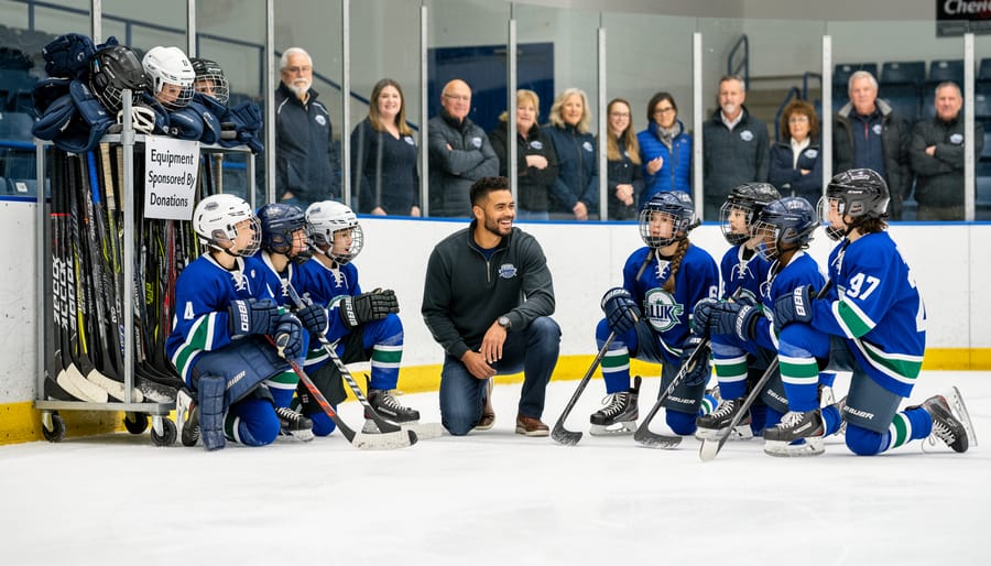 Young hockey players trying on new equipment funded through charitable donations